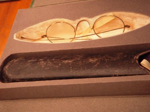 Whitman's glasses. The right eye is frosted over.