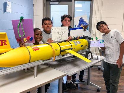 Students with a model of Rutgers Glider